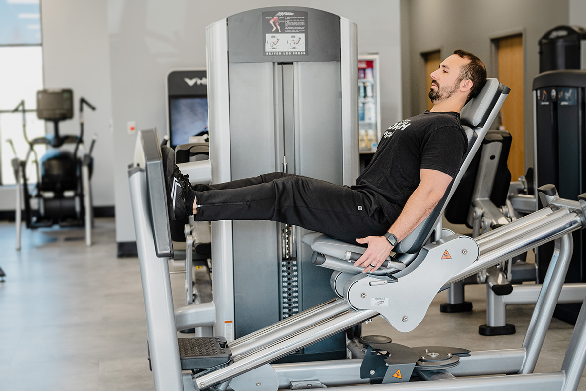 Coach Mike in the fully extended leg press position.