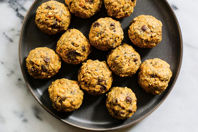 Peanut butter energy bites on a plate.