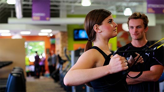 woman working out with trx bands