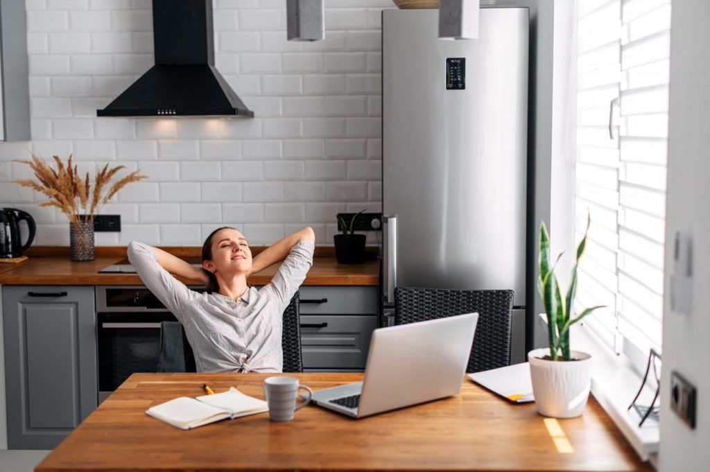woman relaxing in front of computer