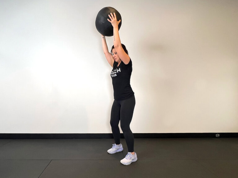 Coach slams medicine ball to ground.