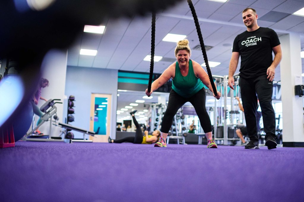 Member training with a Coach at an Anytime Fitness gym.