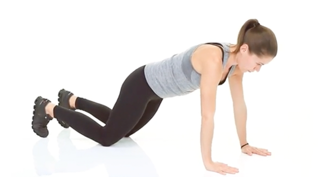 woman doing a modified push up