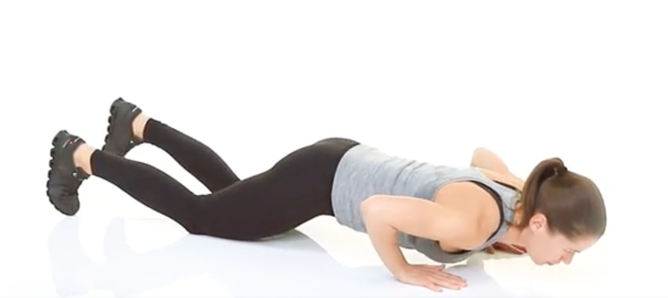 woman doing a modified push up