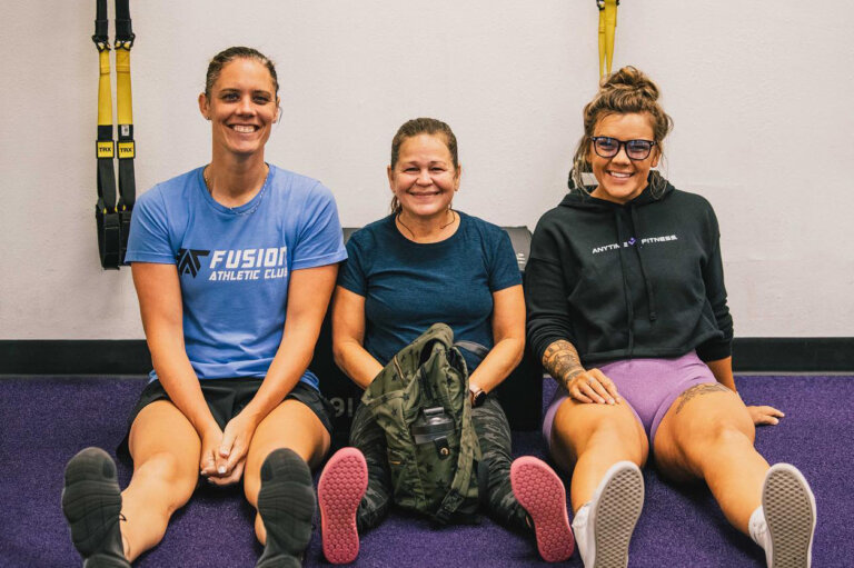Christy with Coach Jen and Coach Mariah.