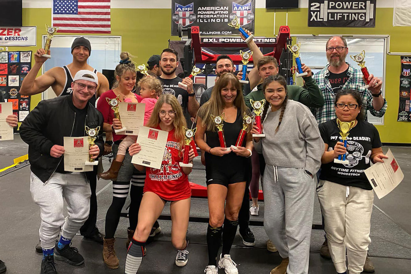 Jaymie and the Anytime Fitness Woodstock crew at a weight-lifting competition in Illinois.