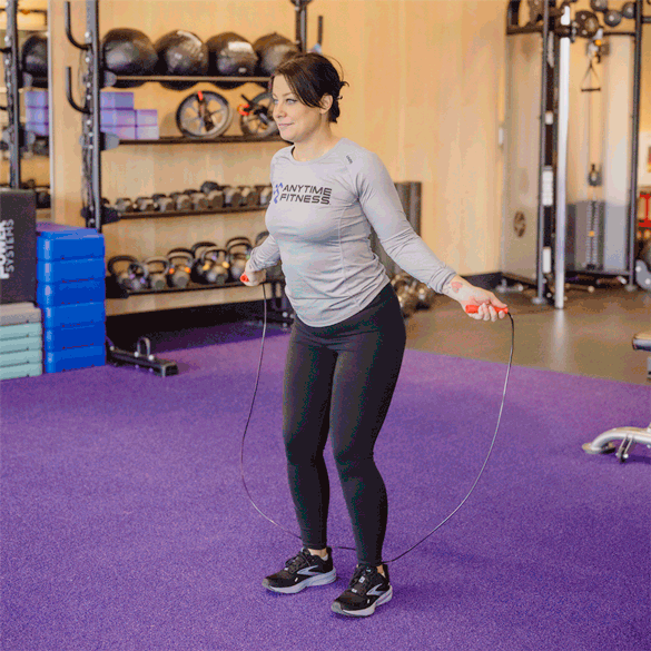 Coach jumping rope with feet together, jumping side to side.