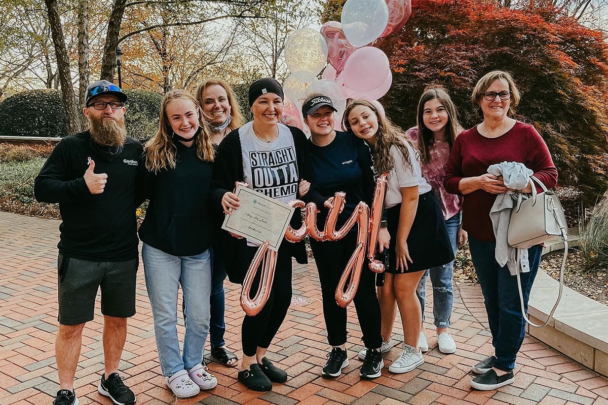 Mary after being released from the hospital, accompanied by friends and family.