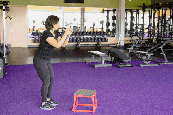 Coach Heather demonstrating a 12-inch box jump.