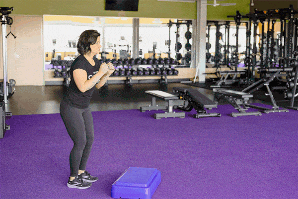 Coach Heather demonstrates a box jump with a small plyo box.