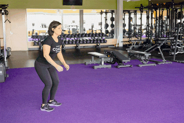 Coach Heather demonstrating a broad jump.