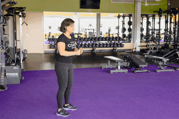 Coach Heather demonstrating a squat jump.