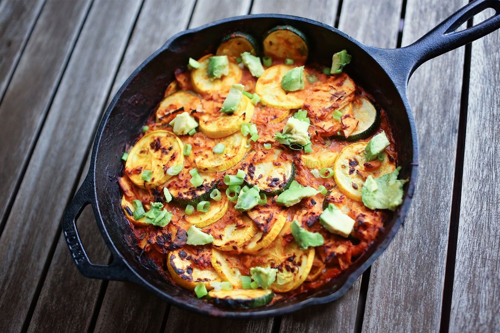 Zucchini and cheese dip in a cast iron skillet.