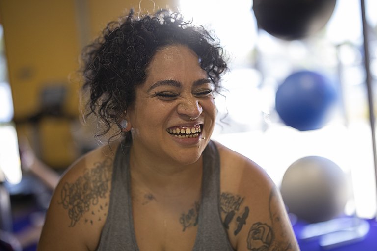 Candie smiling in the gym.