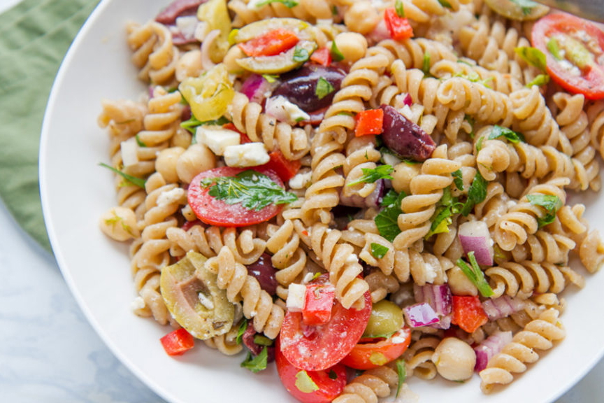 One plated serving of veggie-packed Greek pasta salad.