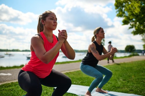 Two women doing an outdoor workout.