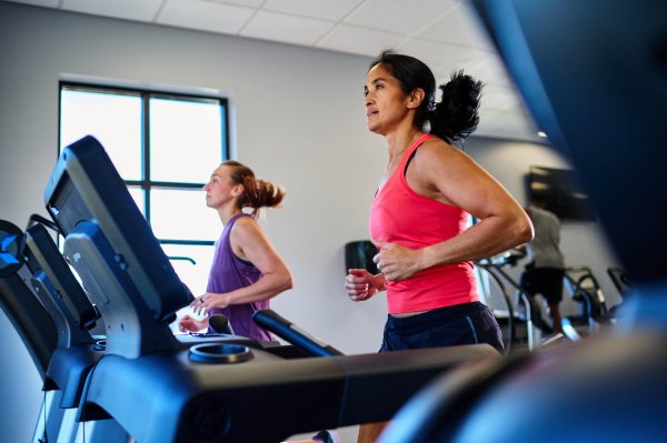 Woman running on a treadmill.